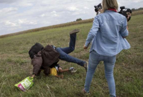Hungarian camerawoman fired after being filmed kicking migrants - VIDEO